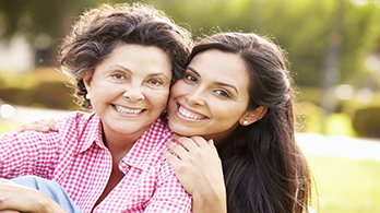 two women hugging and smiling