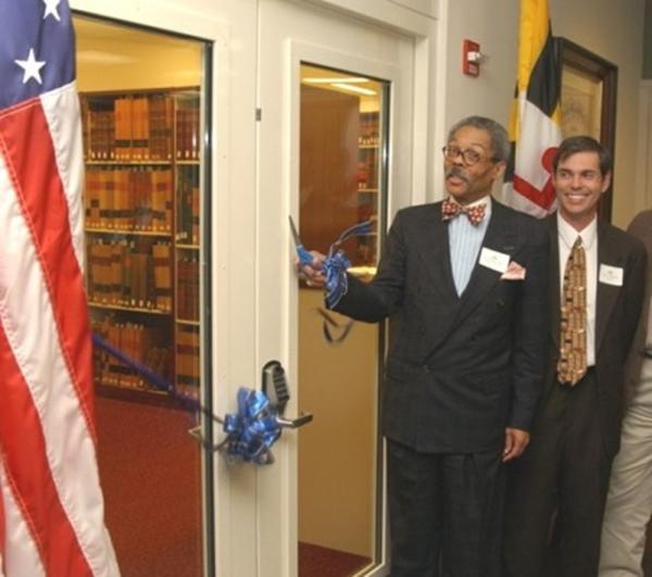 Chief Judge Robert M. Bell of the Court of Appeals cuts the ribbon to the Special Collection Room beside Steve P. Anderson, Library Director (2006)