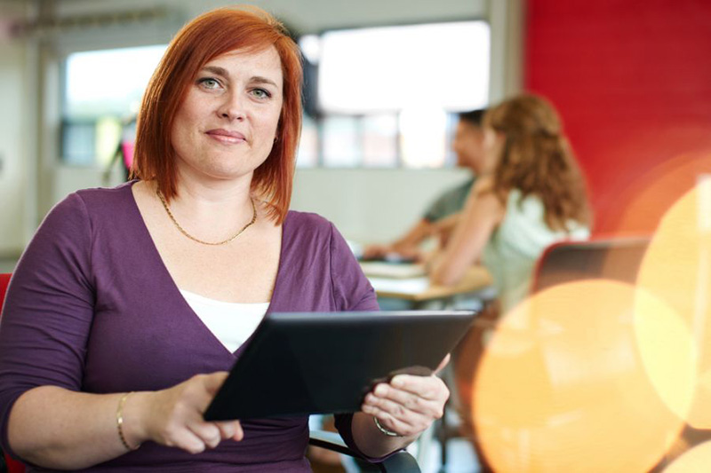 woman holding tablet