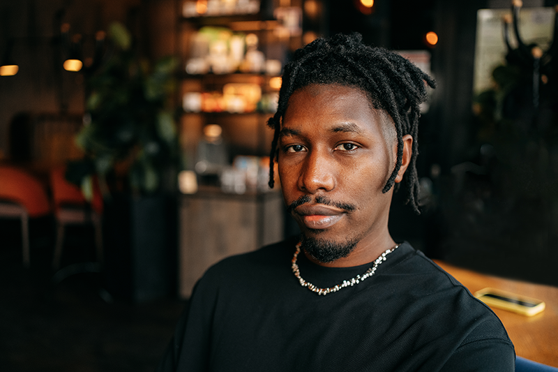 man looking at camera with relaxed expression
