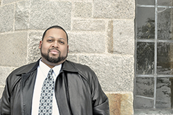 man standing in front of a court building