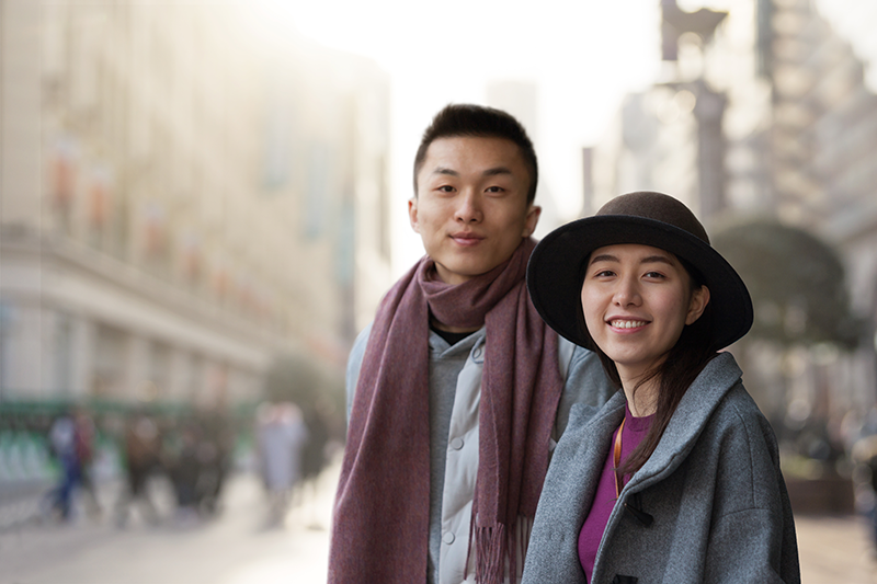 young couple smiling and looking at the camera