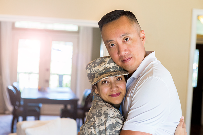 couple hugging and looking at camera