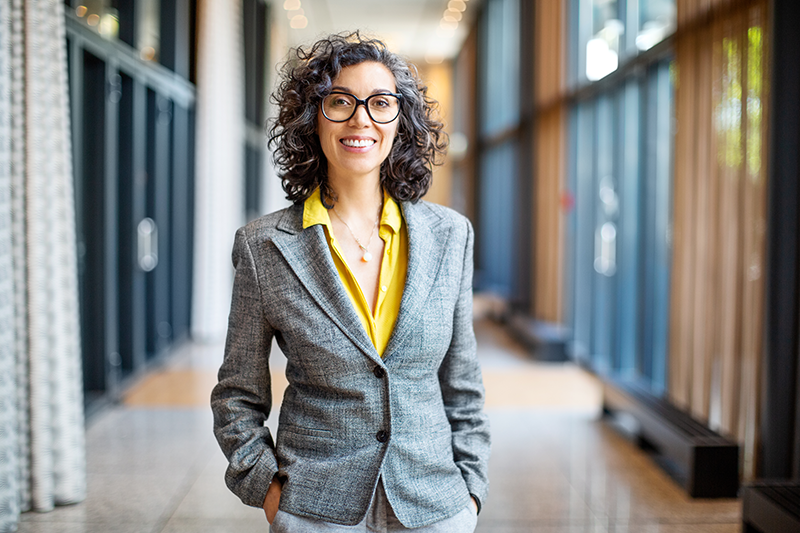 woman standing in hallway of court building