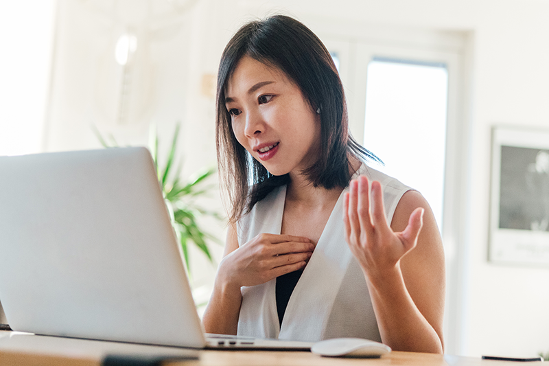 woman talking at computer